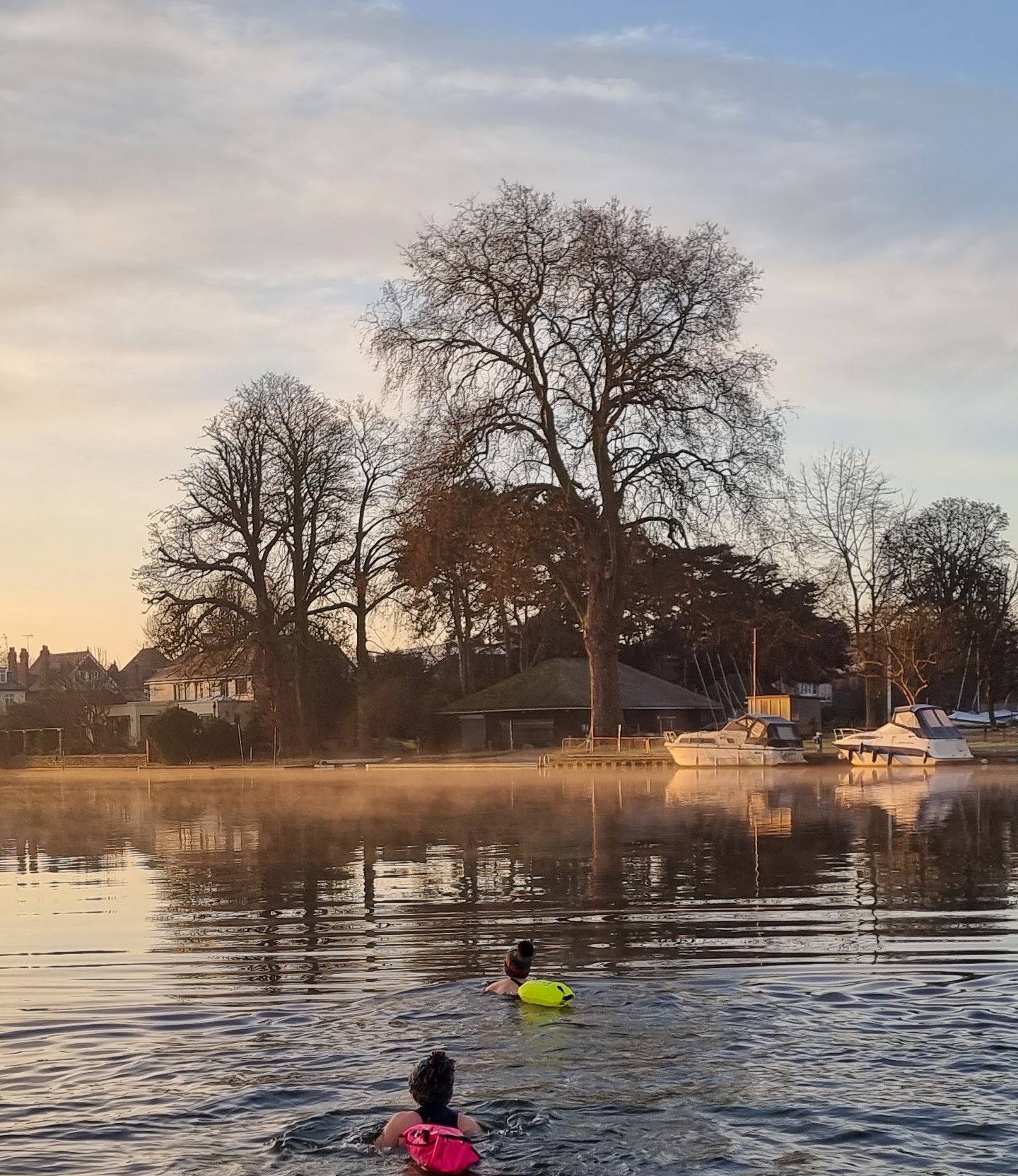 Outdoors swimming with floats in the river Thames