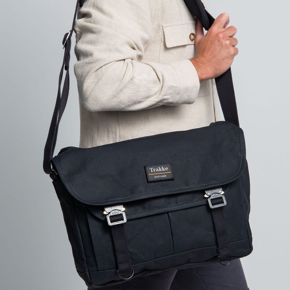 a man carrying a black Bairn Pro Messenger