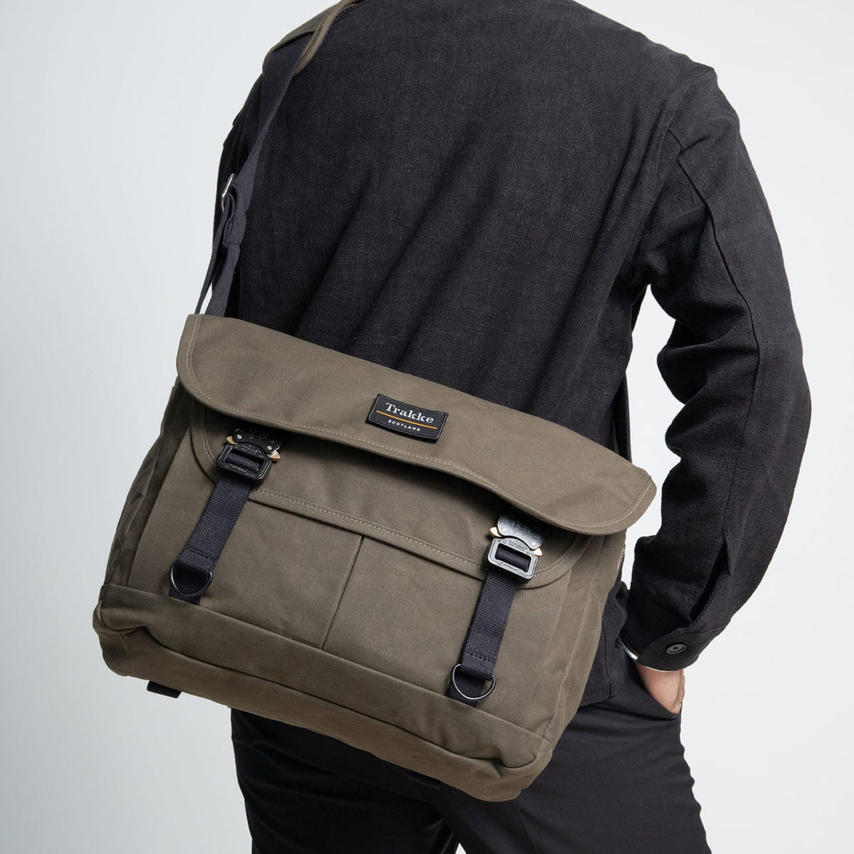 a person with an olive coloured Bairn Pro Messenger on their back