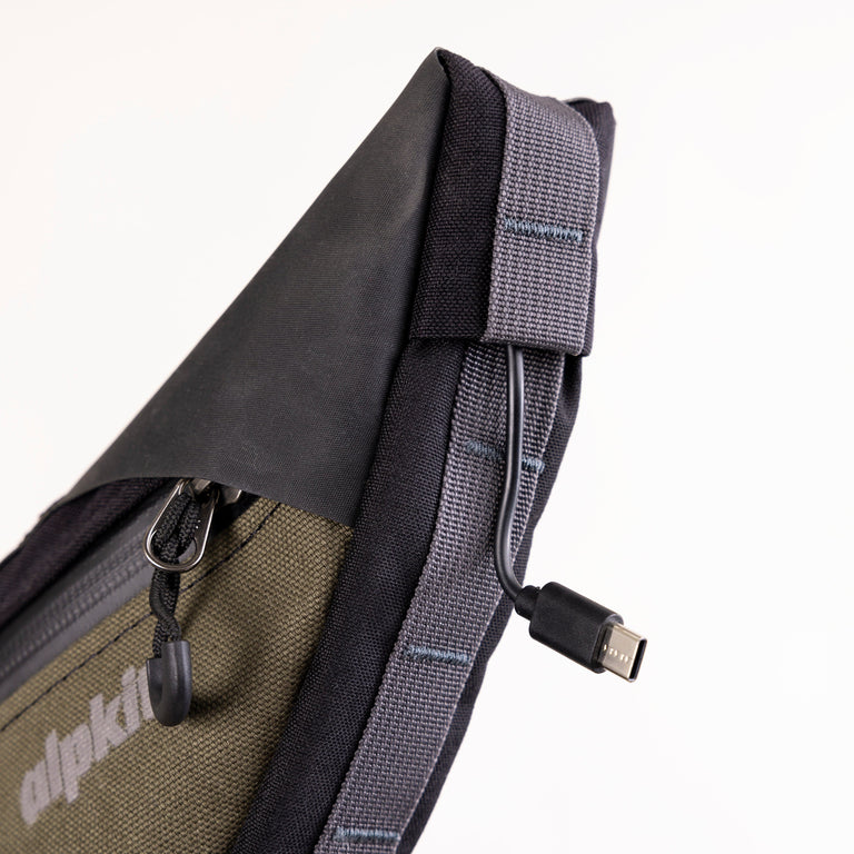 alpkit possum frame bag for bikepacking in olive green cable port