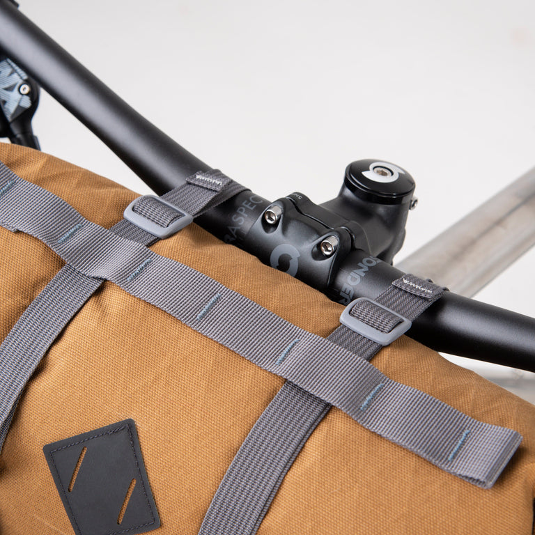 alpkit kuoka handlebar bag for bike packing in mountain brown top