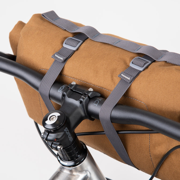 alpkit kuoka handlebar bag for bike packing in mountain brown back