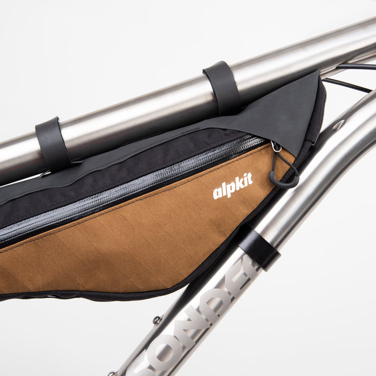 alpkit possum frame bag for bikepacking in mountain brown logo