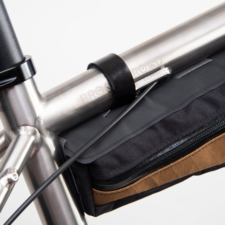 alpkit possum frame bag for bikepacking in mountain brown strap