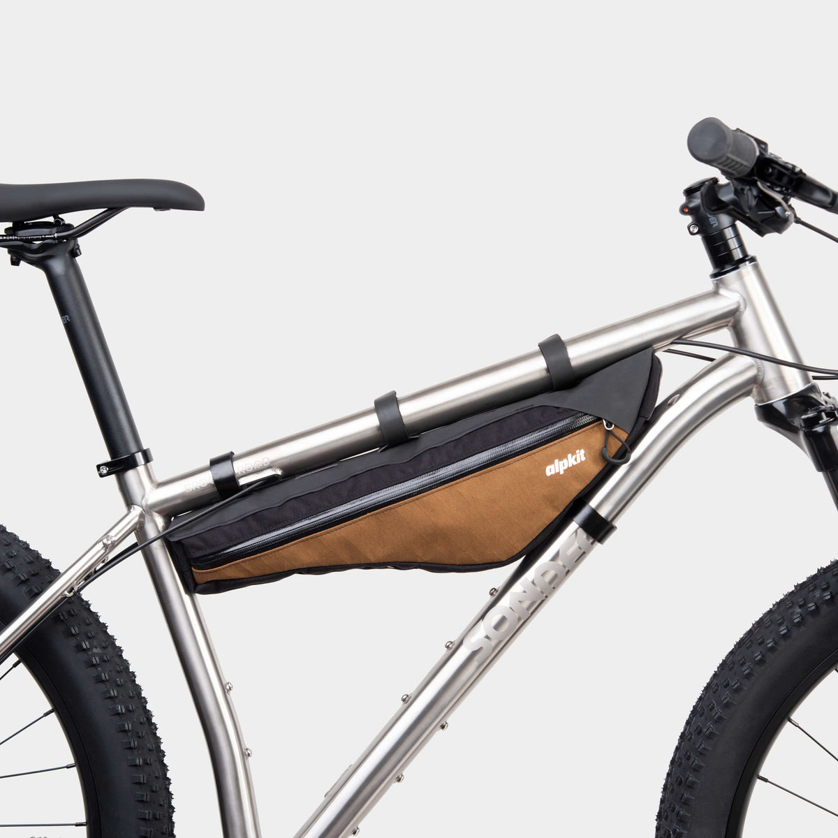 alpkit possum frame bag for bikepacking in mountain brown
