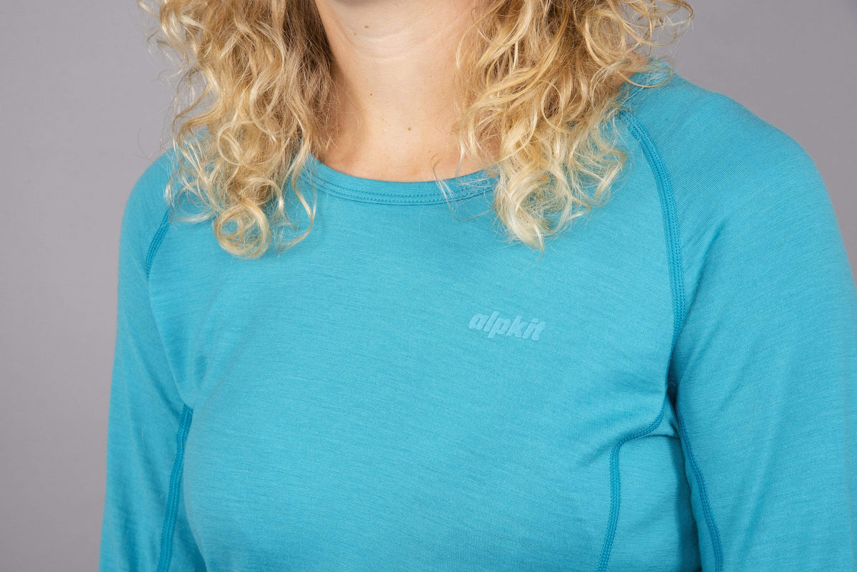 womens Kepler long sleeve merino baselayer in surf logo