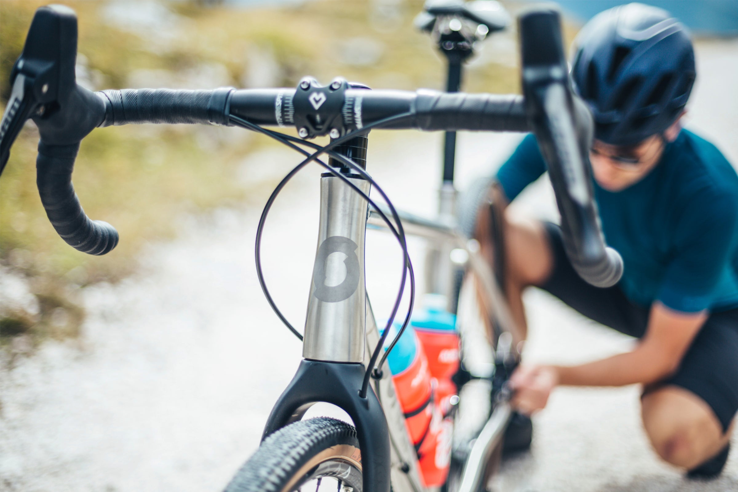 Cyclist adjusting his bike for a comfortable ride
