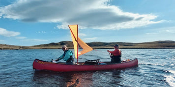 Canoe sailing around Scotland's Isle of Lewis