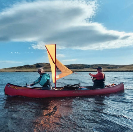 Canoe sailing around Scotland's Isle of Lewis