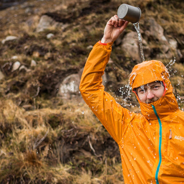 A man and a women trekking in Merino wool base layers in the French Alps