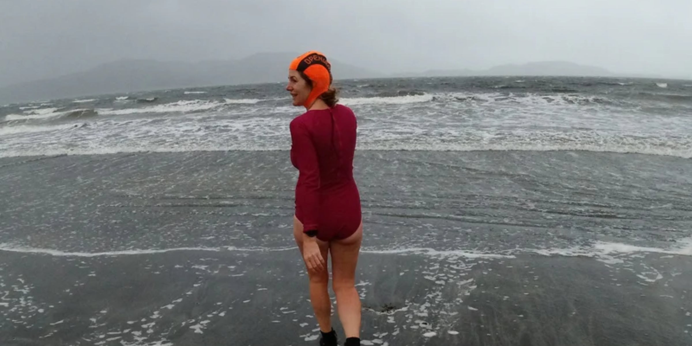 Wild swimmer entering the sea
