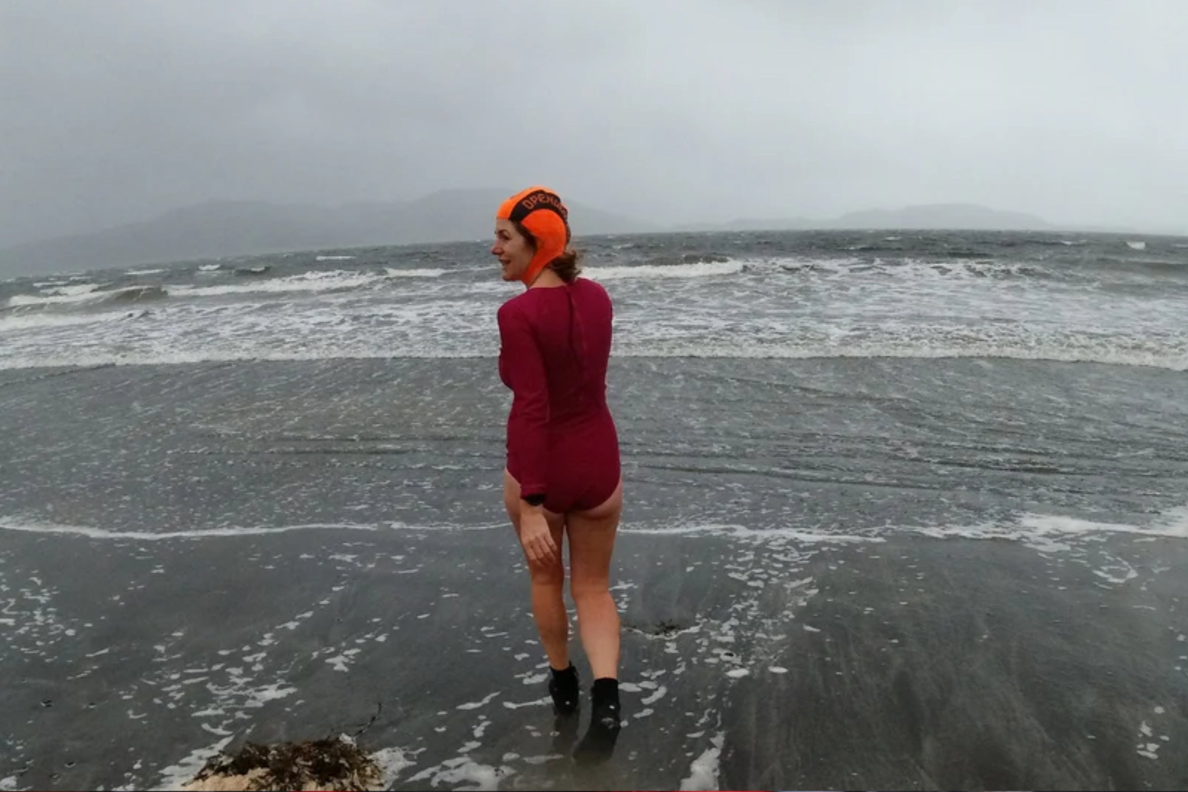 Wild swimmer entering the sea
