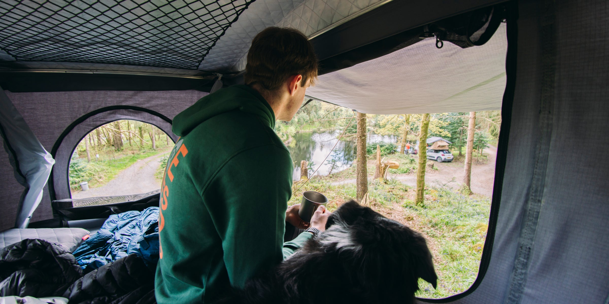 Camper and dog in roof tent