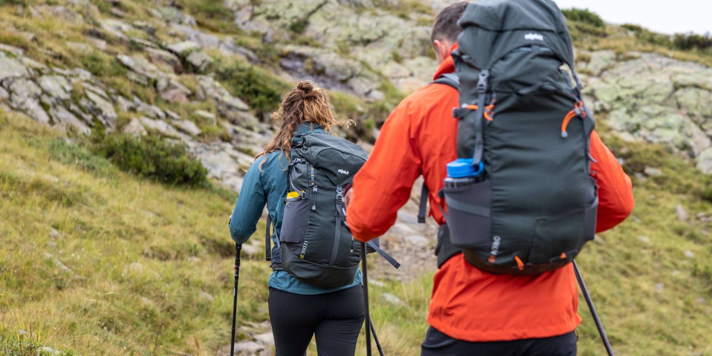 Hillwalkers with loaded rucksacks