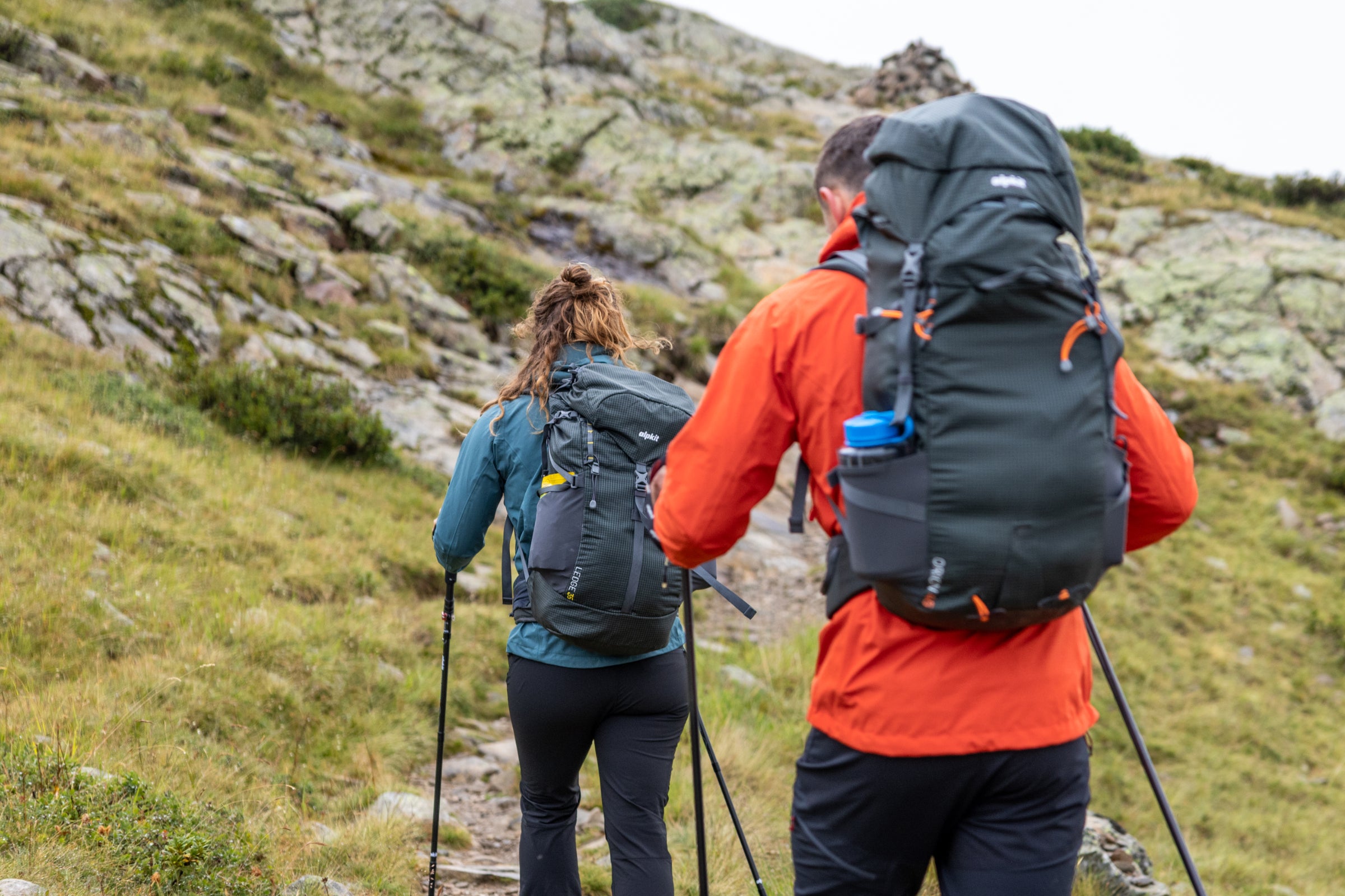 Hillwalkers with loaded rucksacks