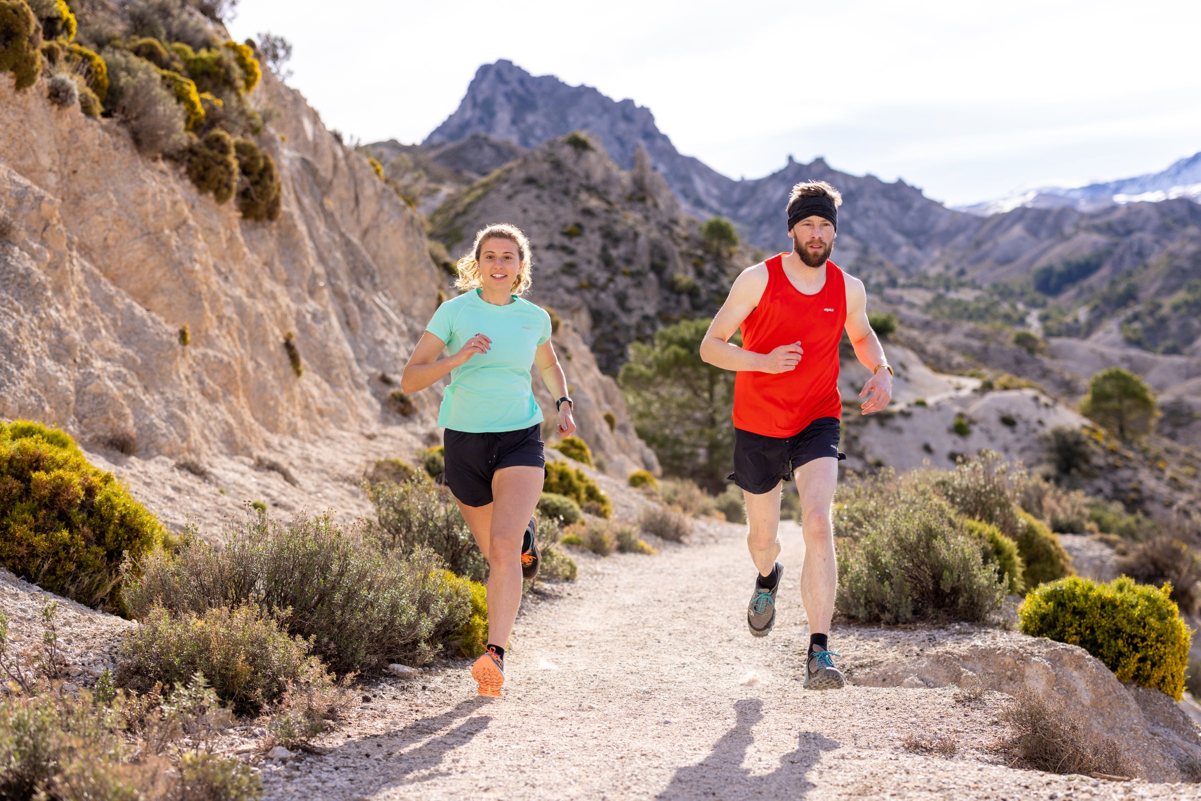 2 Trail runners wearing base layers in hot weather 