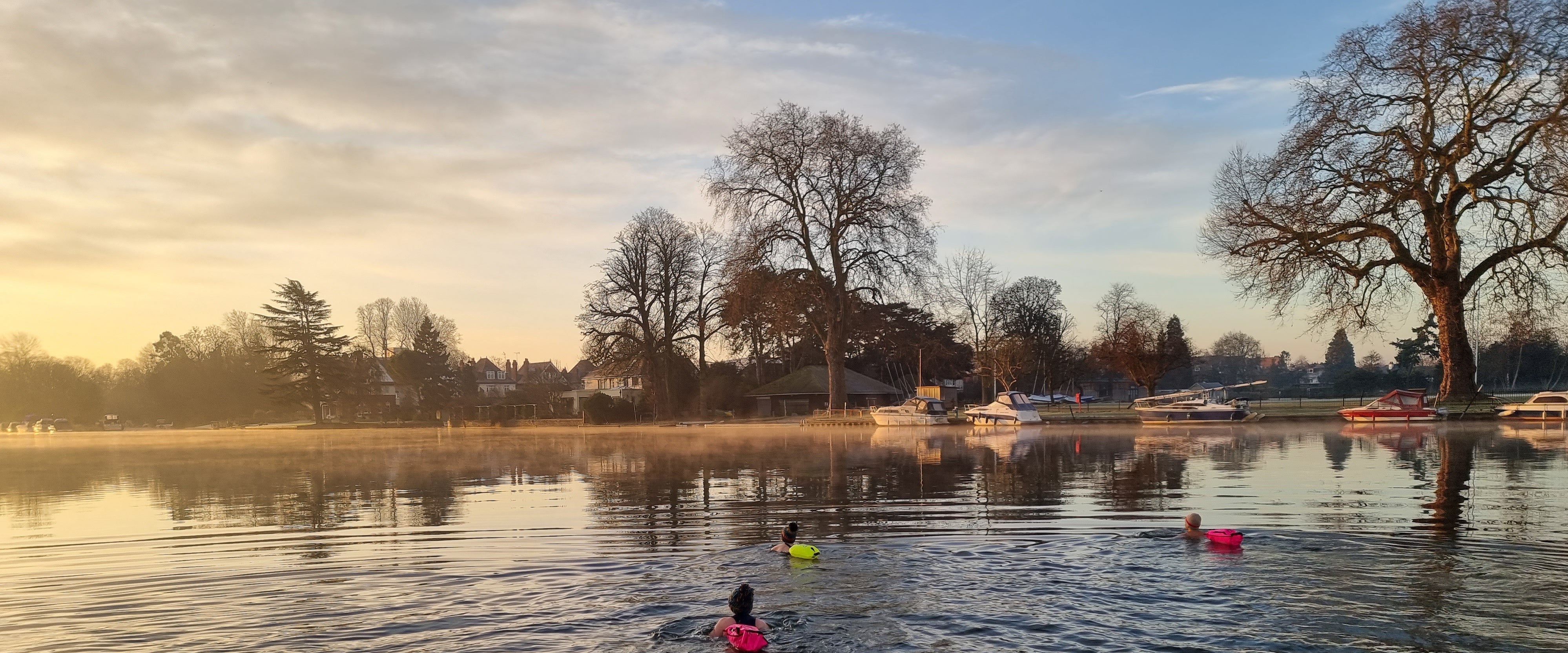 Outdoors swimming with floats in the river Thames