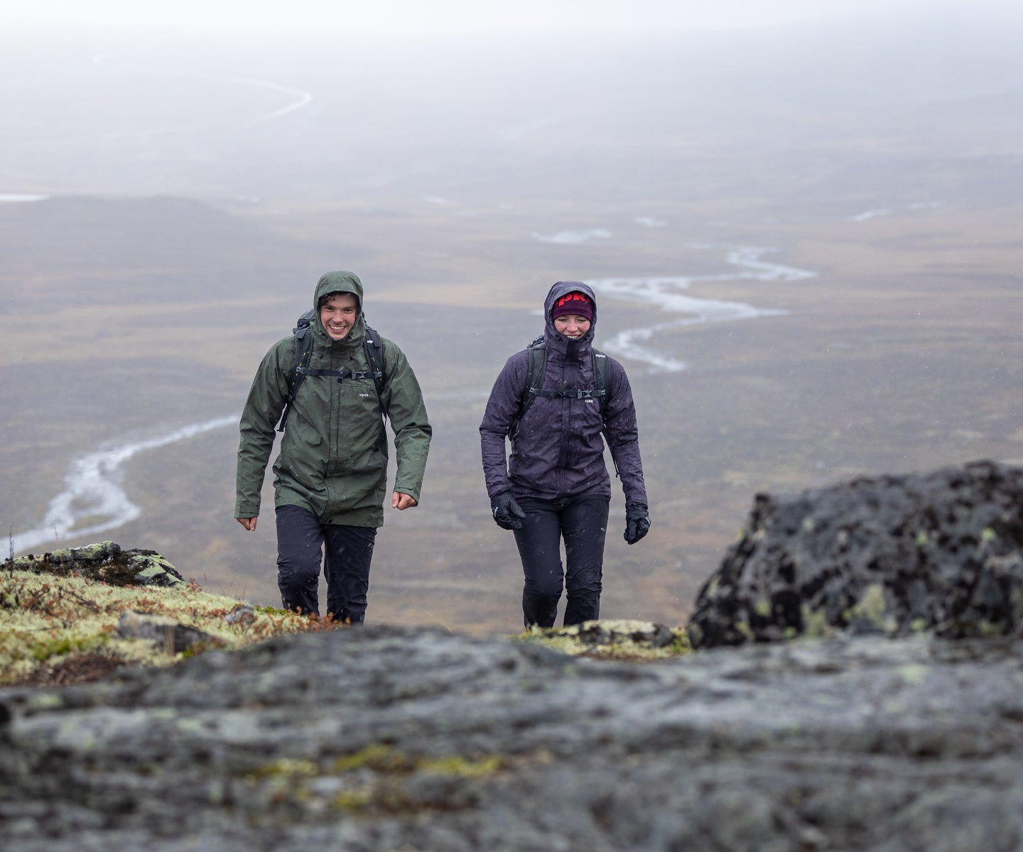 Hillwalkers hiking in the rain