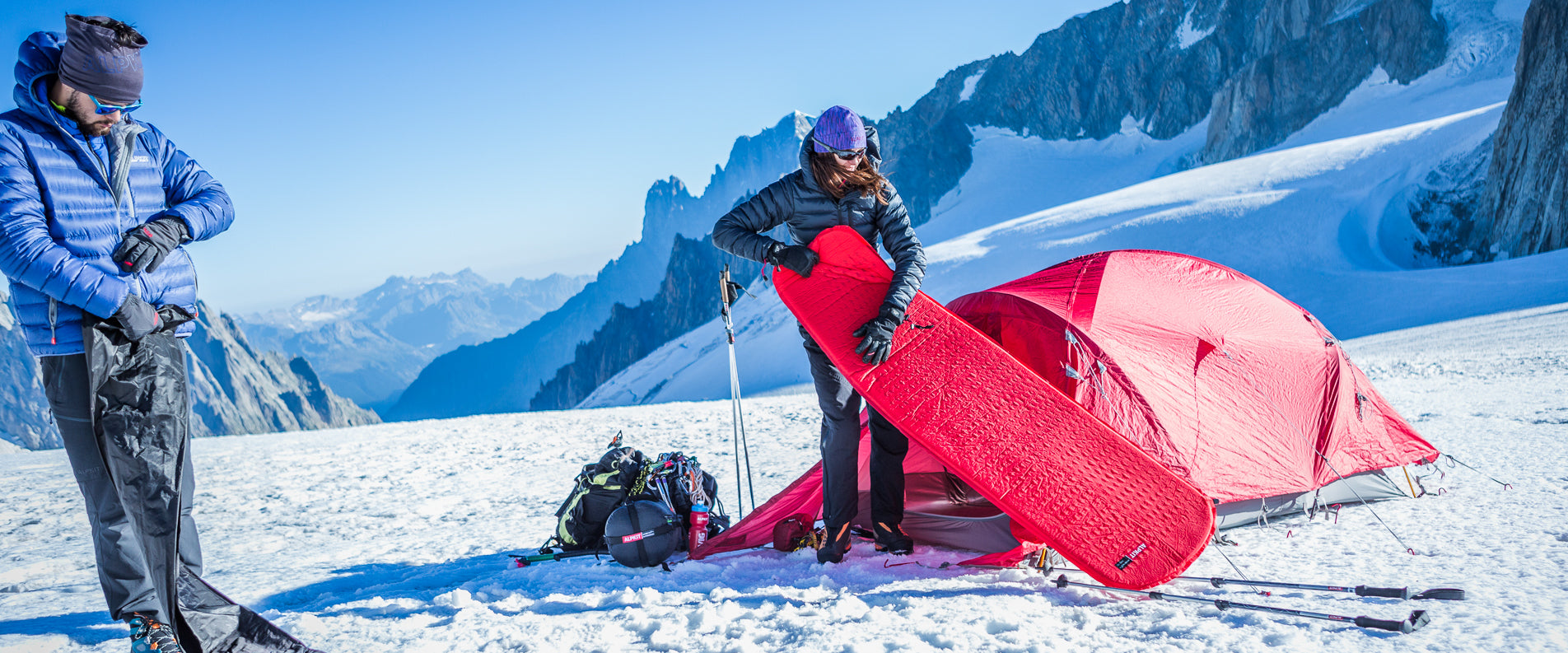 Preparing a camping mat for sleeping on the snow