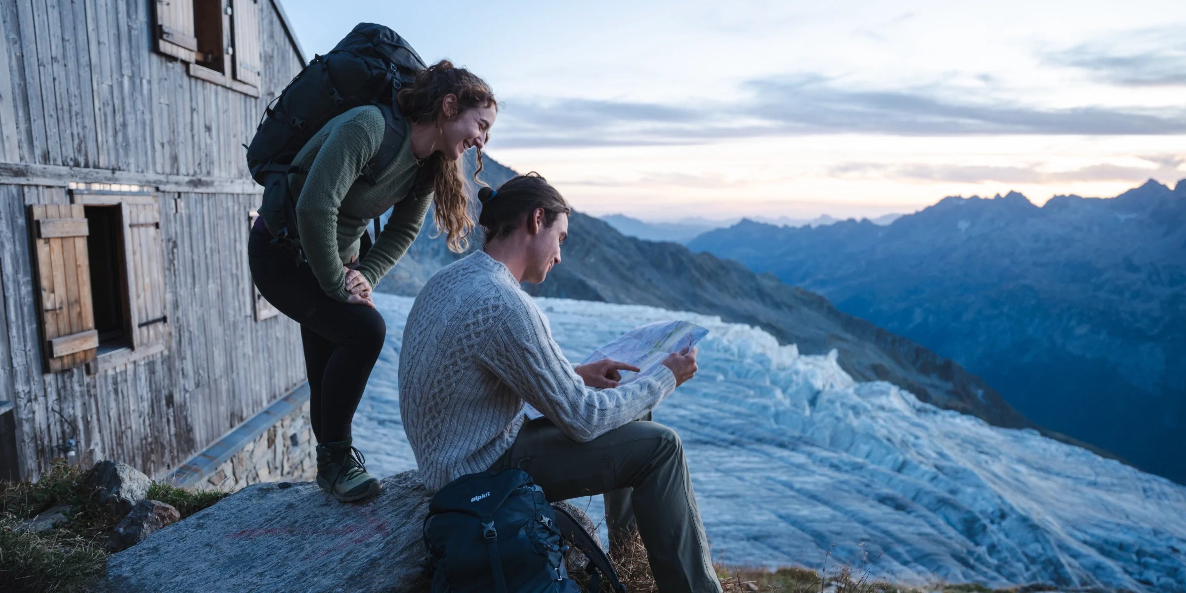 Hikers in alpine hut wearing wool clothing