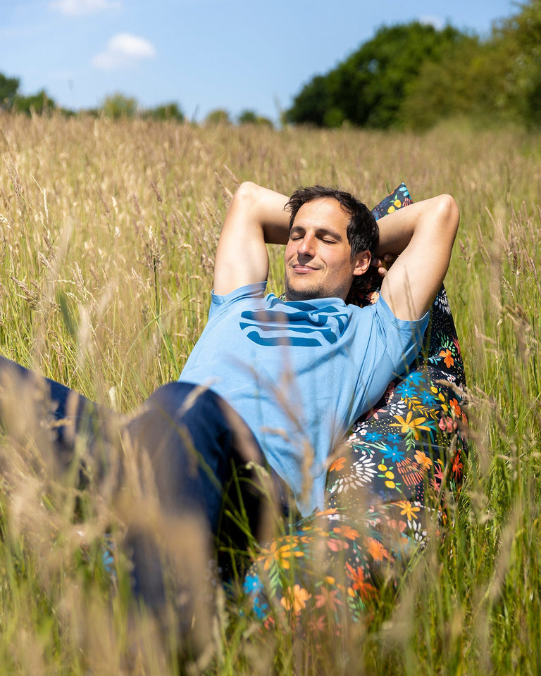 man sat on an Alpkit Bean Mountain bean bag