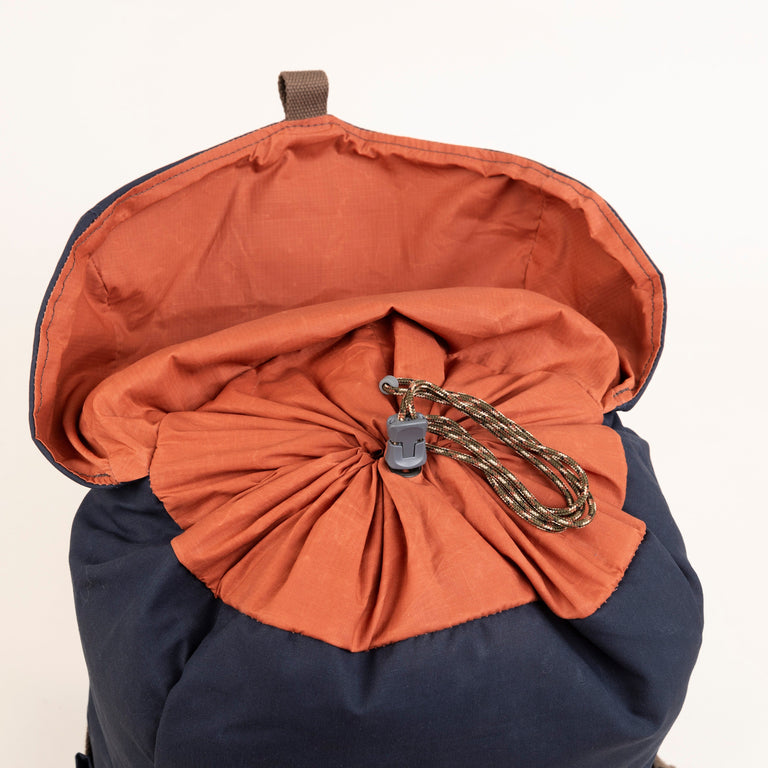 alpkit brevent backpack in navy drawstring closure