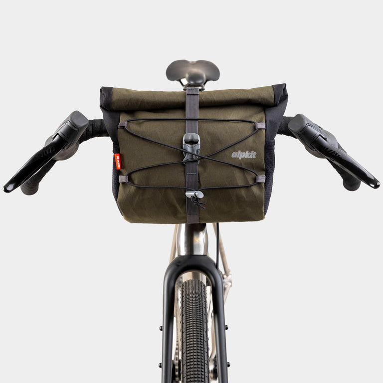 alpkit gravel bag handlebar bag for drop bars in olive green