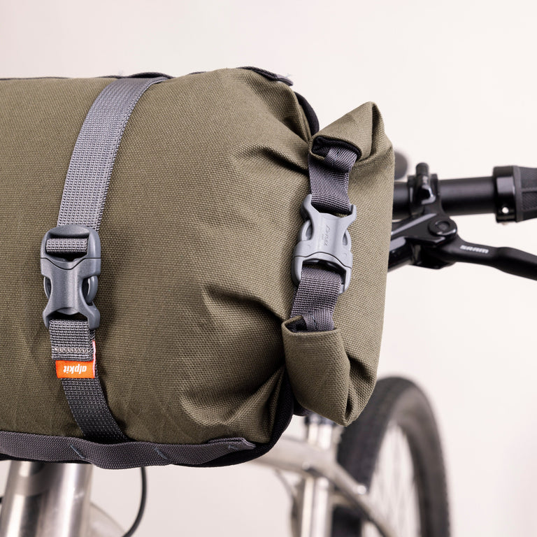 alpkit kuoka handlebar bag for bike packing in olive green logo rolltop