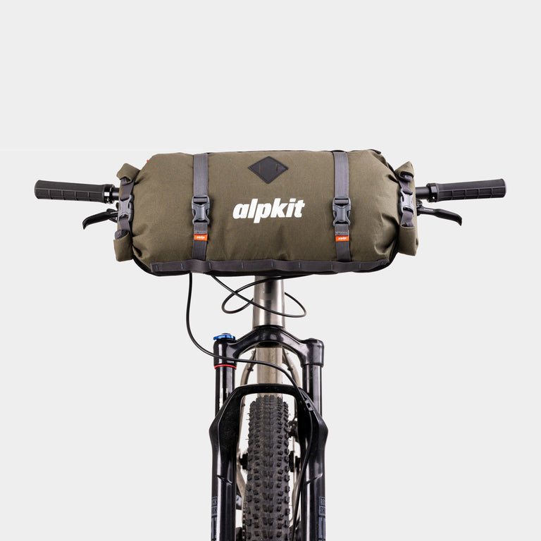 alpkit kuoka handlebar bag for bike packing in olive green