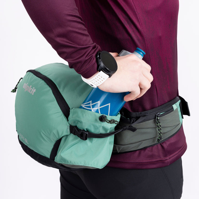 Vora 6L hip pack bottle access