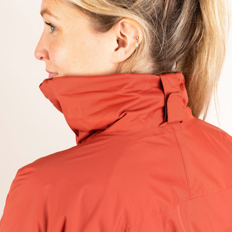 Alpkit women's Atalanta waterproof jacket in Brick red foldaway hood