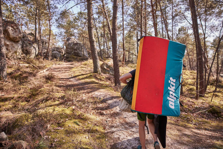 Zofia Reych hiking into Font with the Origin taco bouldering mat - action