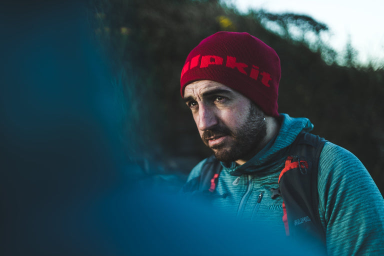 man wearing alpkit mountain beanie - action