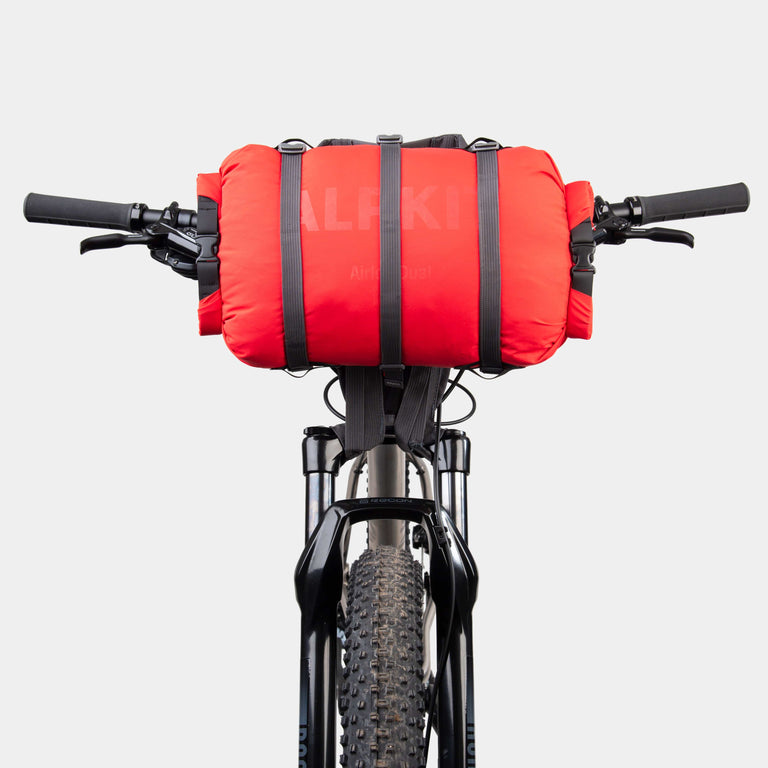 airlock dual 13l dry bag with double ended rolltop for bikepacking on handlebars in chilli red