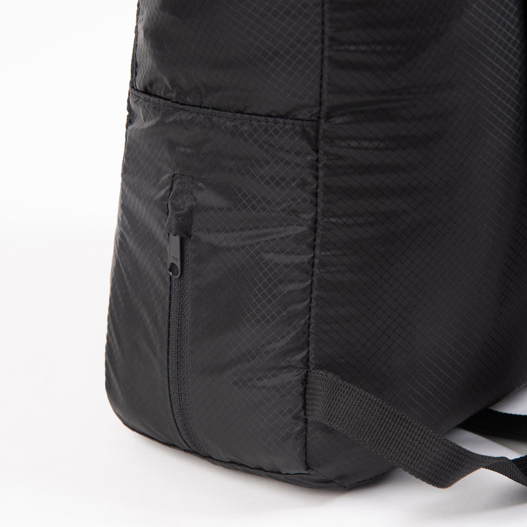 alpkit atom packable back pack in black pocket