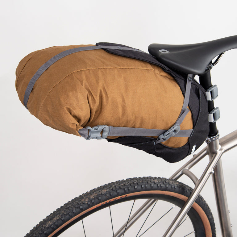 alpkit big papa 17 litre seatpack for bikepacking in mountain brown top