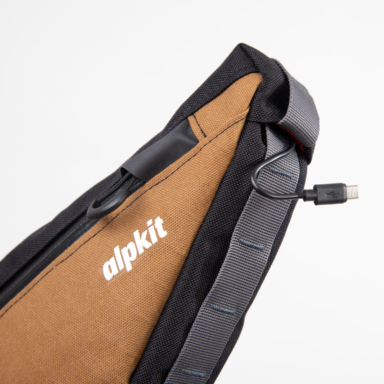 alpkit bilbie framebag in mountain brown logo cable port - closed