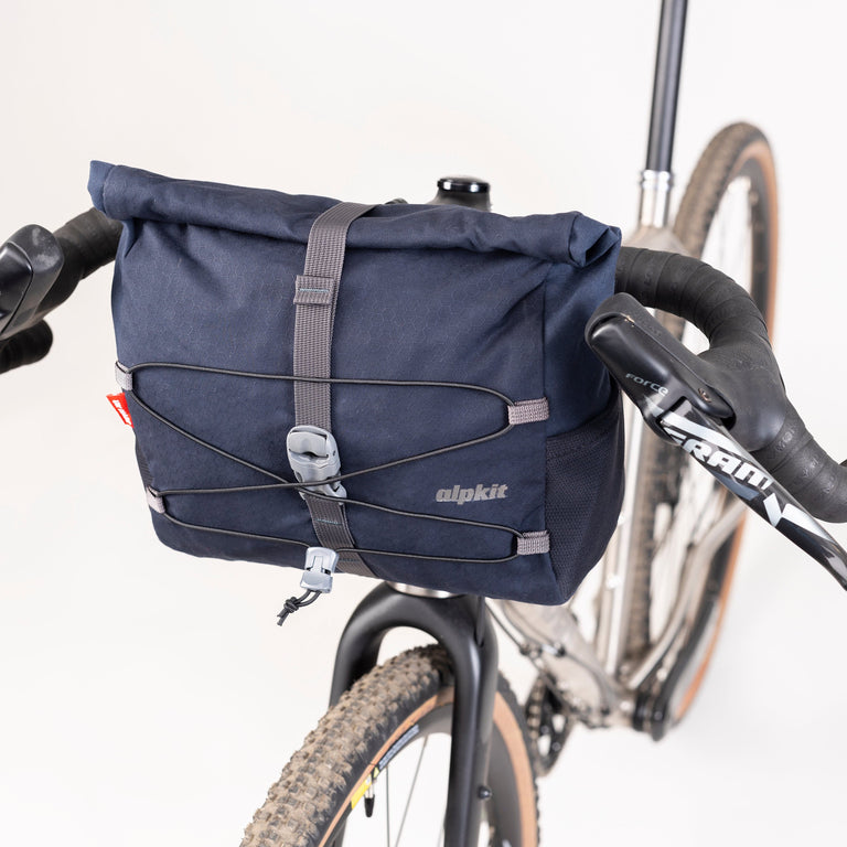 alpkit gravel bag bar bag in navy roll top