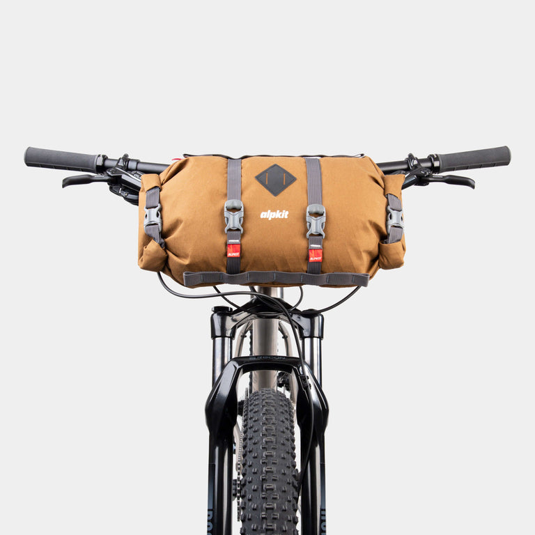 alpkit kuoka handlebar bag for bike packing in mountain brown