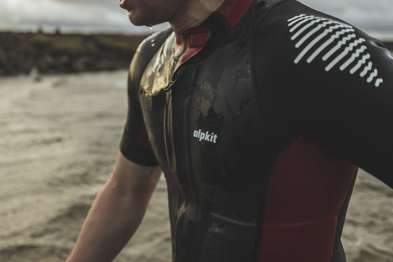 alpkit duel mens swim run wetsuit in red and black