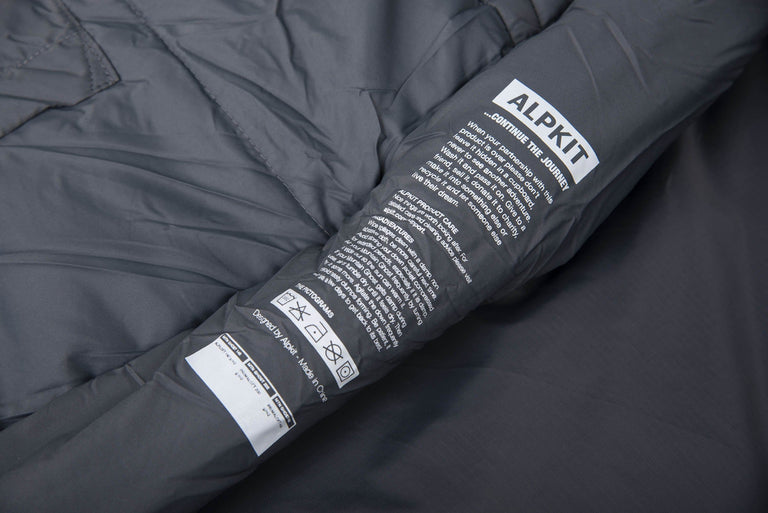 The care label and washing instructions printed on the inside of a Mountain Ghost 200 synthetic 2 season sleeping bag