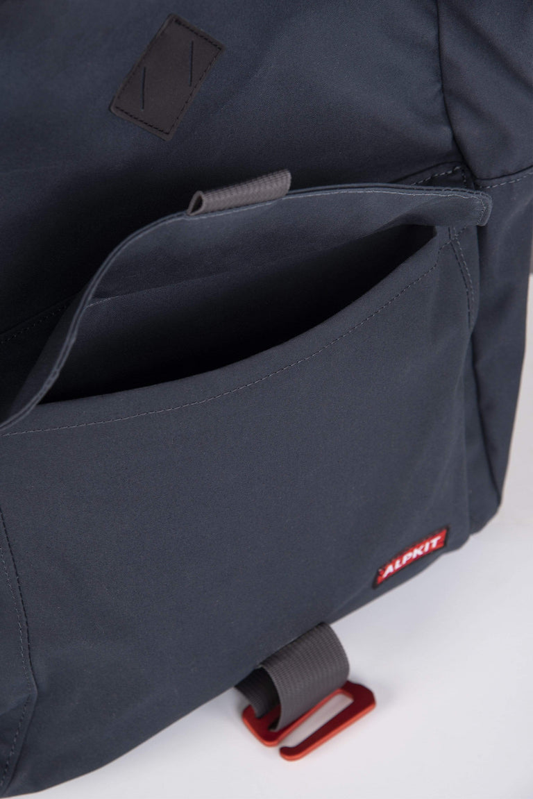 Alpkit pelmo wax cotton pack in denim outside pocket - closed