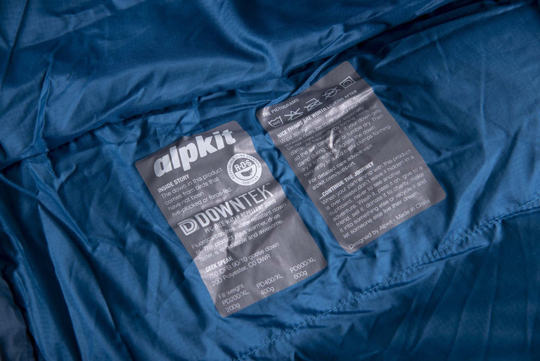 The care label and washing instructions printed on the inside of a Pipedream 400 lightweight 3 season sleeping bag