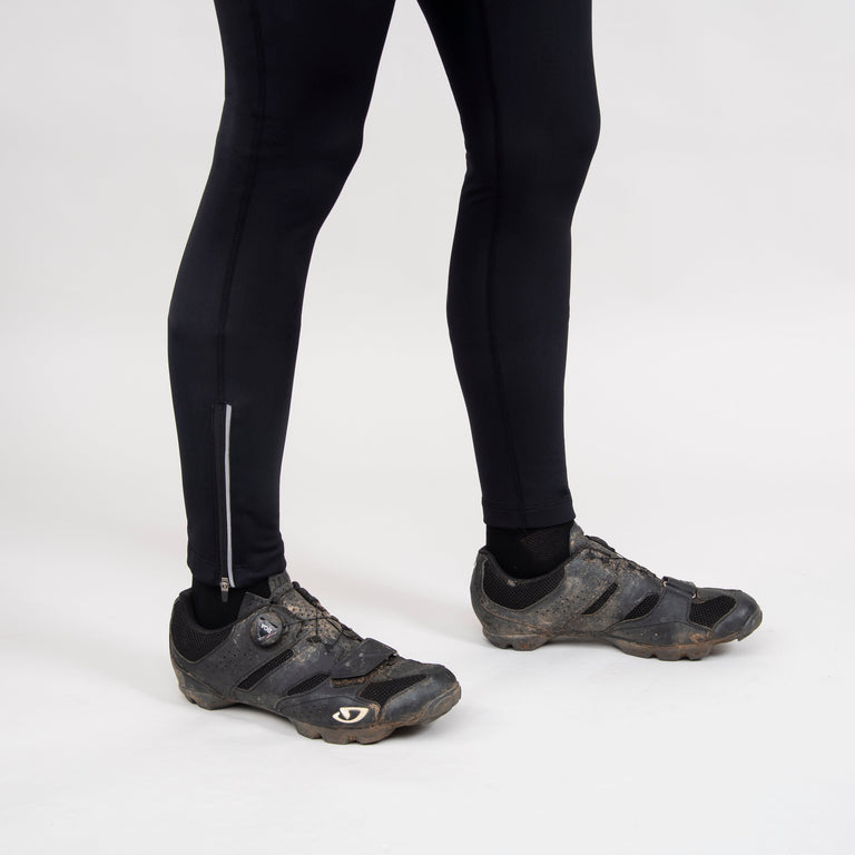 alpkit womens rhythm four season bib tights in black hem ankle zip reflective stripe