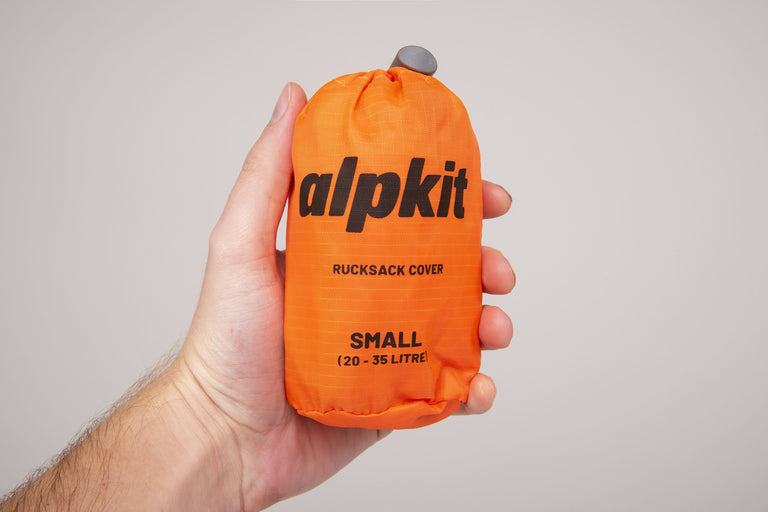 alpkit rucksack cover in orange small 20-35 litre